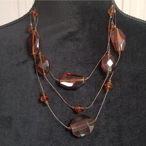 $$ = 3/$15. Vintage brown beaded 3-strand necklace